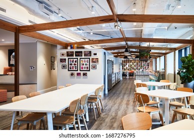 Sydney, NSW/Australia-July 15 2018:Interior Photography Of A Contemporary Design Corporate Office Break Out Area With Kitchen, Tables & Chairs And Games Room Off To The Side