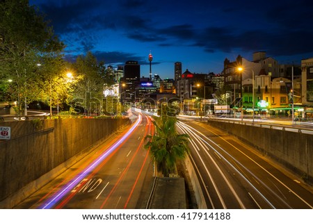 Sydney traffic and modern building scene.