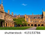 Sydney Uni inner yard with students in the distance enjoying break. University of Sydney courtyard against deep blue sky with white clouds, daytime photo
