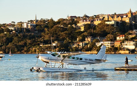 SYDNEY,AUSTRALIA - JULY 27,2014: A Cessna 208 seaplane taxis out of Rose Bay for takeoff.