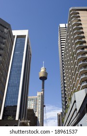 Sydney's centrepoint tower and skyscrapers against a blue sky