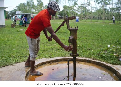 Sylhet, Bangladesh - 15 August 2022: A Person Taking Fresh Water From A Tube Well.