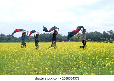 Sylhet, Bangladesh - 15 December 2014: A beautiful view of the red and green color flag (the national flag of Bangladesh) on a yellow background under the blue sky.