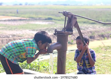 Sylhet, Bangladesh - 19 November 2017: The Children Are Drinking Water From A Tube Well.