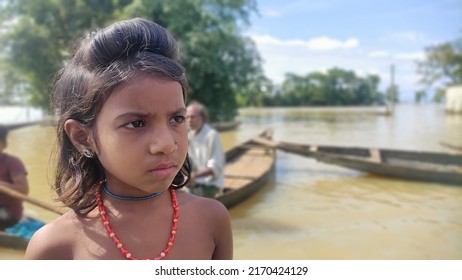 Sylhet, Bangladesh - 22 June 2022: A child from a flood-affected family is waiting for relief.