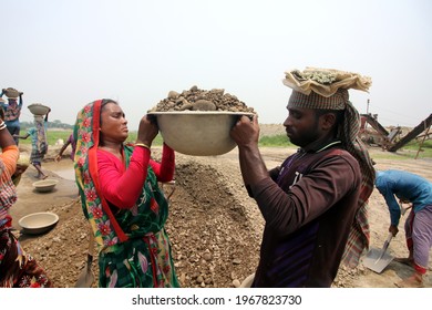 Sylhet, Bangladesh - 30 April 2021: Workers working in a stone crushing factory. Where men and women are working equally together. But women workers are being deprived due to pay inequality.