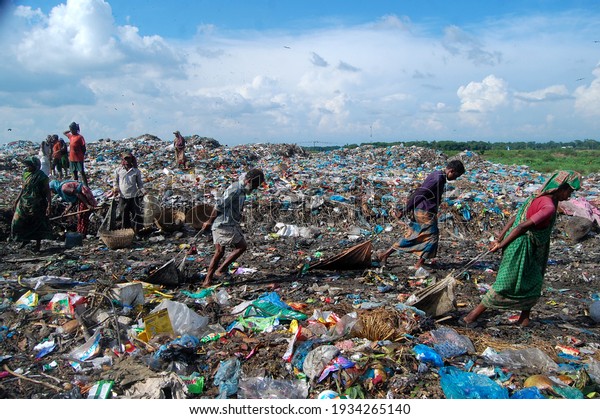 Sylhet, Bangladesh - 6 October 2015: Workers are\
working in Toxic waste dumping management with health risks without\
adequate safety.