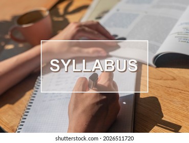 Syllabus word over photo with hand closeup writing in notebook.