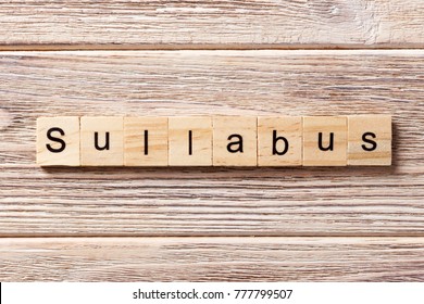 SYLLABUS word written on wood block. SYLLABUS text on table, concept.