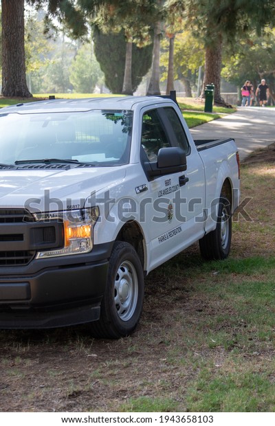 Sylmar, California, United States - October 21,\
2020: Los Angeles County Parks and Recreation logo and seal on\
trucks at a construction project at Veterans Memorial Community\
Regional Park.