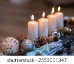 The symbol of Advent is an Advent wreath with four candles. The fourth Advent candle carries the message of Love