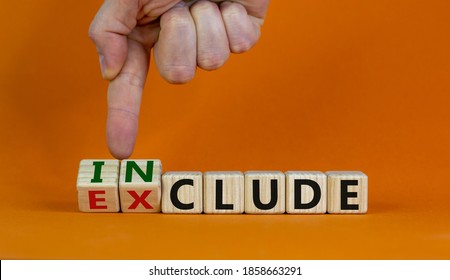 Symbol for a better inclusion. Male hand turns wooden cubes and changes word exclude to include. Beautiful orange background. Copy space. Better inclusion concept. - Shutterstock ID 1858663291