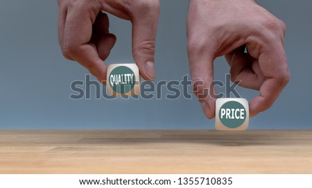 Symbol for choosing quality instead of a cheap price. Two Hands hold two dice with the words 
