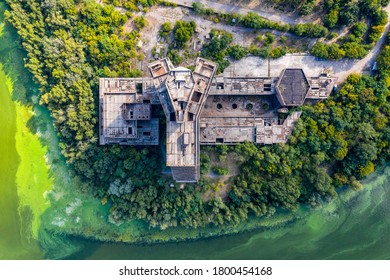 The Symbol Of The City Of Dnepropetrovsk Is The Unfinished Building Of The Parus Hotel On The Embankment Of The Dnieper River. Unusual Angle. Aerial View With A Drone. Summer Photo.