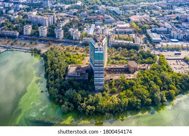 The Symbol Of The City Of Dnepropetrovsk Is The Unfinished Building Of The Parus Hotel On The Embankment Of The Dnieper River. Unusual Angle. Aerial View With A Drone. Summer Photo.