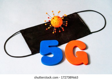 Symbol Of Coronavirus And 5g Network Next To A Medical Mask. The Effect Of 5g Networks On Coronavirus