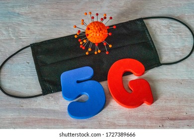 Symbol Of Coronavirus And 5g Network Next To A Medical Mask. The Effect Of 5g Networks On Coronavirus