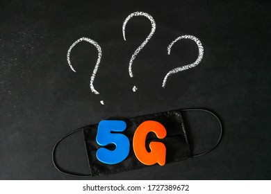 Symbol Of Coronavirus And 5g Network Next To A Medical Mask. The Effect Of 5g Networks On Coronavirus