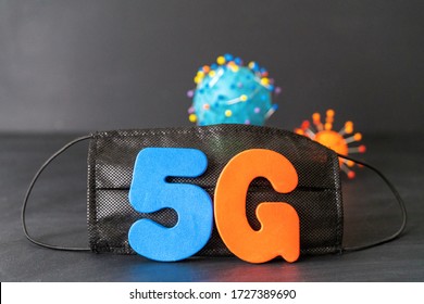 Symbol Of Coronavirus And 5g Network Next To A Medical Mask. The Effect Of 5g Networks On Coronavirus