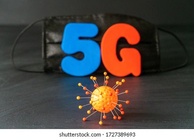 Symbol Of Coronavirus And 5g Network Next To A Medical Mask. The Effect Of 5g Networks On Coronavirus