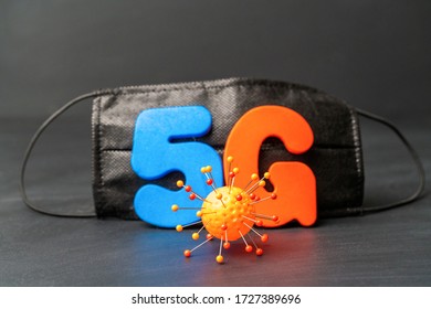 Symbol Of Coronavirus And 5g Network Next To A Medical Mask. The Effect Of 5g Networks On Coronavirus