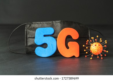 Symbol Of Coronavirus And 5g Network Next To A Medical Mask. The Effect Of 5g Networks On Coronavirus