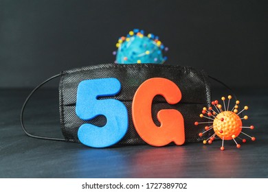 Symbol Of Coronavirus And 5g Network Next To A Medical Mask. The Effect Of 5g Networks On Coronavirus