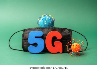 Symbol Of Coronavirus And 5g Network Next To A Medical Mask. The Effect Of 5g Networks On Coronavirus