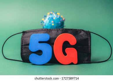 Symbol Of Coronavirus And 5g Network Next To A Medical Mask. The Effect Of 5g Networks On Coronavirus