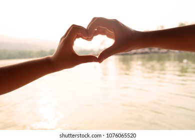 Symbol Couple Hands On Sea Beach Hart Symbol With Hand In Holiday Time.