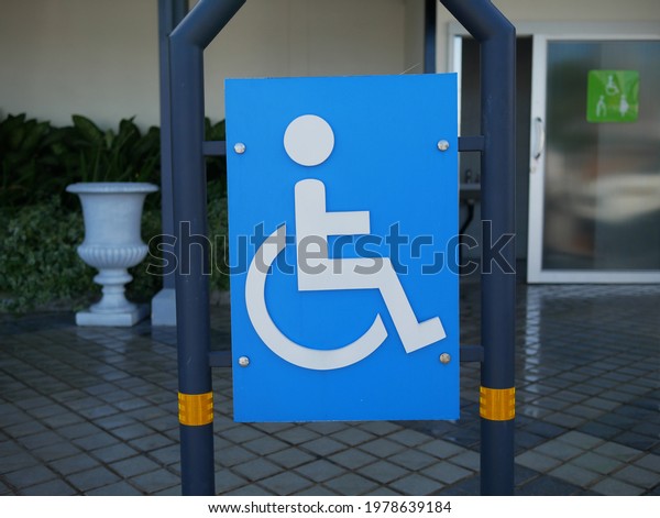 symbol\
handicapped parking area in gas\
station.