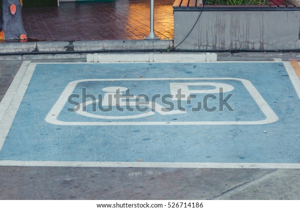 Symbol of the handicapped person,Disabled\
parking sign in filling station,\
Thailand.