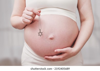 A Symbol Of The Jewish Religion In The Hands Of A Pregnant Woman, Home Living Room