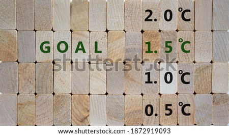 Symbol for limiting global warming. Wooden blocks with word 'Goals 1.5 C'. 0.5 C, 1.0 C, 2.0 C numbers. Beautiful wooden background, copy space. Business and limiting global warming concept.
