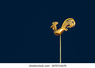 Symbol of old Riga town - golden cockerel (rooster) topping bell tower of Riga Doms Cathedral.