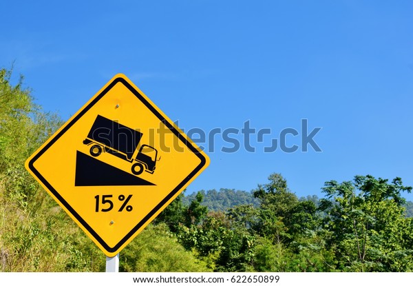 The symbol of the route of the car. Road sign,\
steep slope. Focus\
selection.