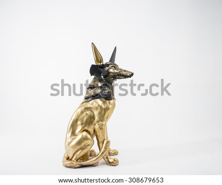 Symbol, sculpture of the Egyptian god Anubis, gold figure and black jackal