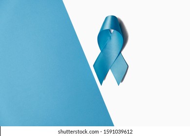 Symbol for support men. Blue ribbon on white and blue background. Prostate Cancer Awareness, Movember Men's health awareness. Healthcare, International men, Father and World cancer day concept.