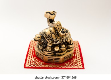 Symbol Of A Turtle Figurine On A White Background , Feng Shui