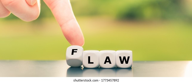 Symbol for an unpopular law. Hand turns dice and changes the word law to flaw.