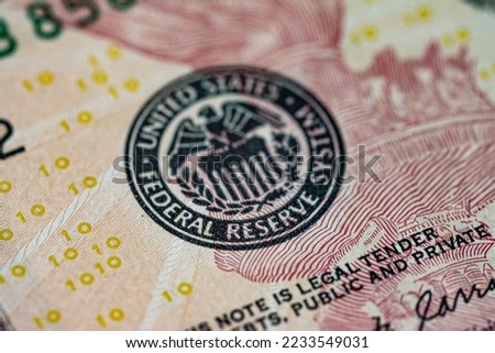 Symbol of the US Federal Reserve System on the US 10 dollar bill. Fed emblem close-up on american currency.