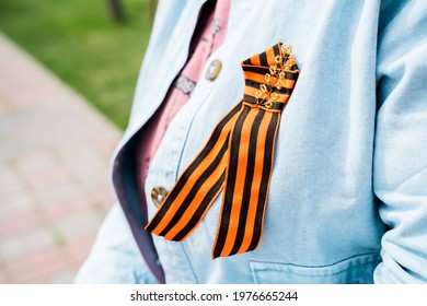 The Symbol Of The Victory Over Fascism Is The St. George Ribbon On A Woman's Denim Jacket