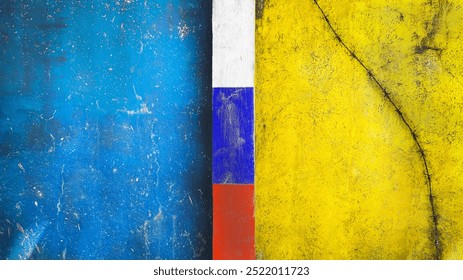 Symbol of war and separatism: a yellow-blue concrete wall with barbed wire and a white-blue-red tricolor on top, flags of Russia and Ukraine.  - Powered by Shutterstock