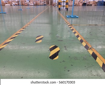 Symbol Yellow And Black Are Walkway On Green Floor In Warehouse For Safety