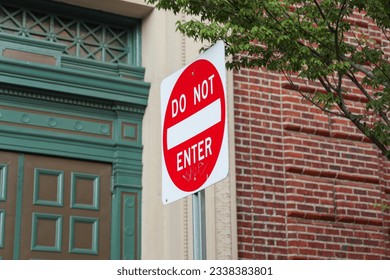 Symbolic 'Do Not Enter' street sign, cautioning against unauthorized access and deterring from forbidden paths in life. Restriction and protection - Shutterstock ID 2338383801
