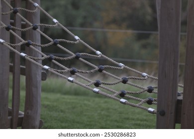 Symbolic image of a children's climbing rope bridge at a playground. Represents active play, child development, and outdoor recreation in safe, fun environments. - Powered by Shutterstock