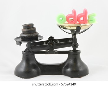 Symbolic Image Displays Weighing Up The Odds On An Old Scales With The Letters ODDS.