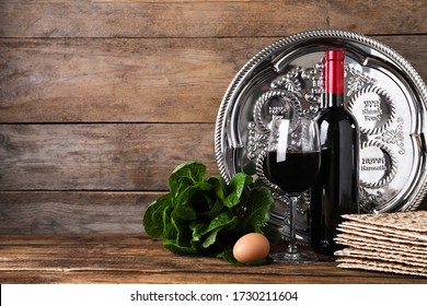 Symbolic Pesach (Passover Seder) Items On Wooden Table, Space For Text