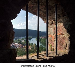 symbolic prison theme with panoramic view outside a barred window at Wertheim Castle in Southern Germany