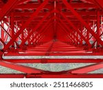 Symbolic red-colored steel frame of Aizhai Bridge, a suspension bridge across the valley in Aizhai, western Hunan, China. One of highest and longest suspension bridges in world.